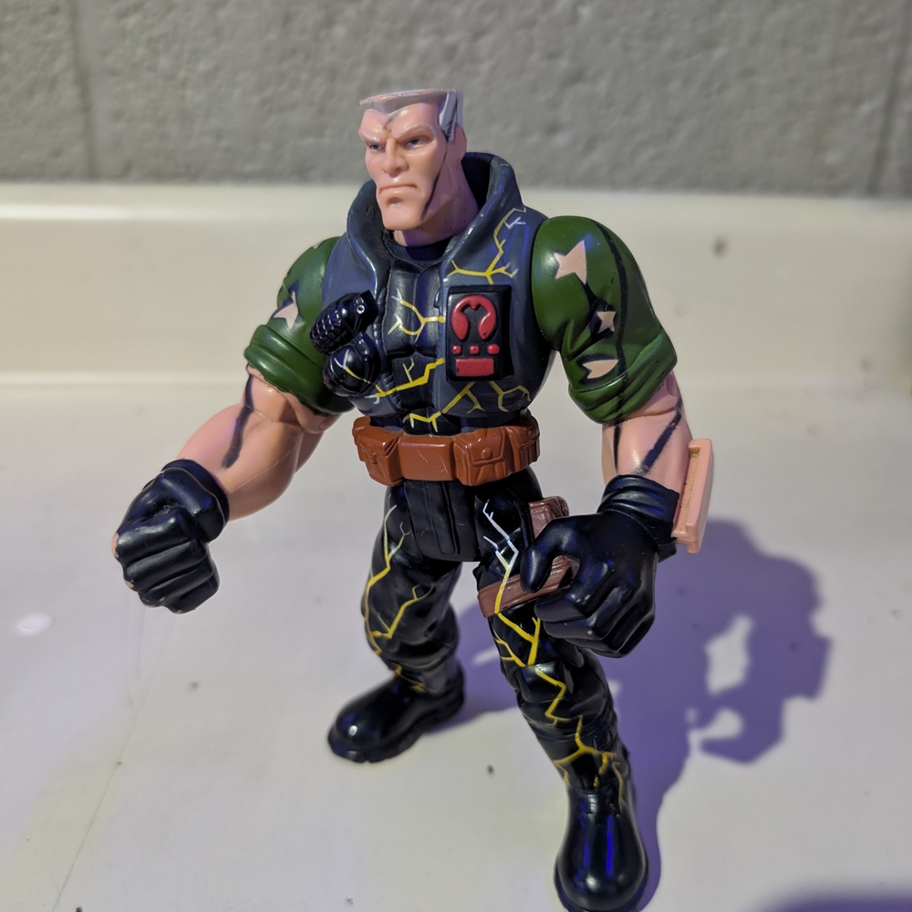Action Figure with Green and Black Outfit